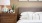 a bed with a lamp on it