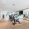 fitness studio with exercise equipment and a large mirror