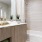 a bathroom with a tub sink and a mirror