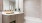 a bathroom with a tub sink and a mirror