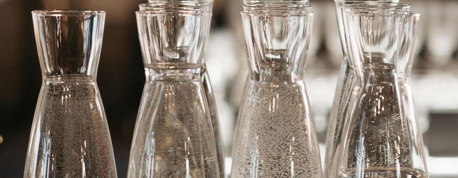 a group of beakers with liquid in them