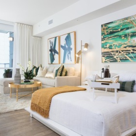 Relax and unwind in well-lit living areas a room with a large painting on the wall