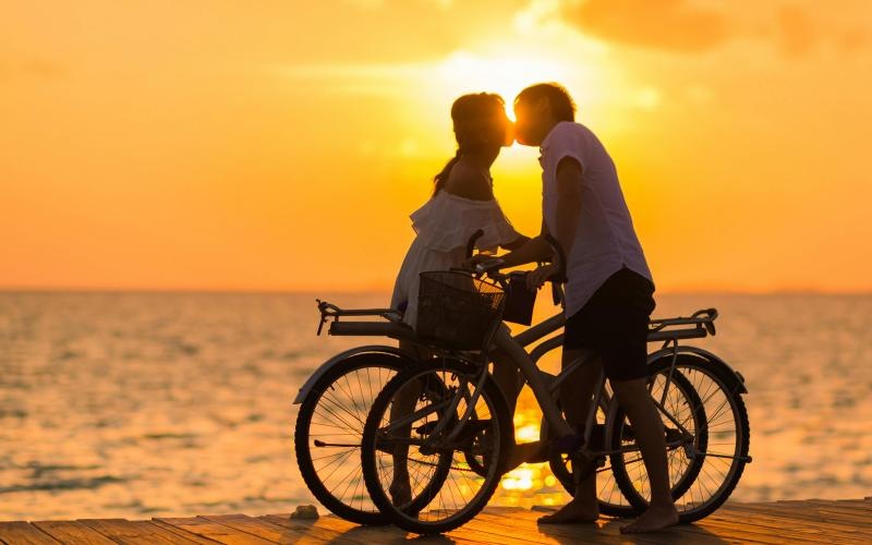 Find your perfect fit at The Rey a man and woman on a bicycle