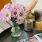 a vase with flowers on a table