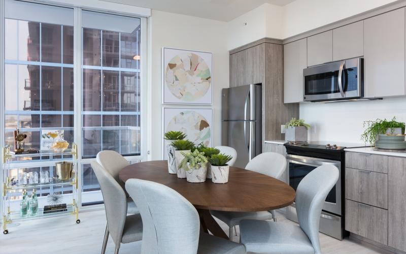 a kitchen with a table and chairs