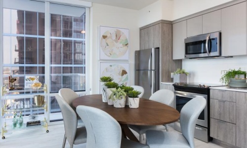 a kitchen with a table and chairs