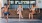 a group of people sitting on a bench eating ice cream