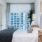 a bedroom with a large window