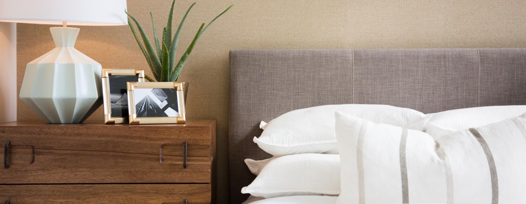 a bed with a lamp on it
