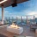 a room with a fire and a view of a city
