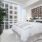 a bedroom with a large window